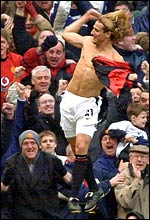 Forlan celebrates his last-minute winner for Manchester United