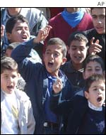 Boys protest outside Mr Hassan's house