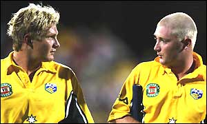 Shane Watson and Michael Clarke leave the pitch after guiding Australia to victory