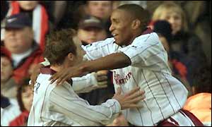 Lee Bowyer hugs Jermain Defoe, who equalises for West Ham on 40 minutes