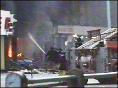 Firemen tackle one of the fires 