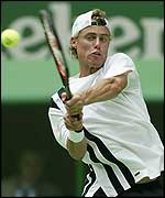 Lleyton Hewitt plays a backhand during his defeat to Younes El Aynaoui