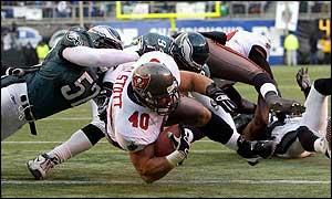 Mike Alstott of the Tampa Bay Buccaneers dives over the goal line for a touchdown 