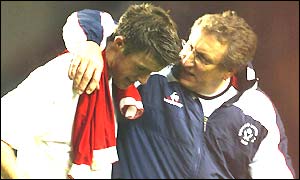 Michael Tonge is comforted by manager Neil Warnock following Sheffield United's defeat