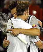 Andy Roddick and Younes El Aynaoui embrace at the end of their match