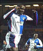 Andy Cole celebrates his goal