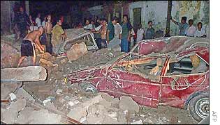 Residents try to shift rubble shortly after the quake hit