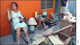 A slightly injured woman waits for help