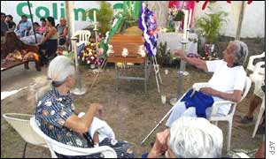 Friends and relatives mourn Maria Rodriguez de Macias, 82