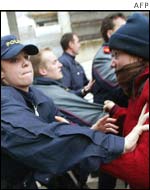 Police and anti-globalisation protestors scuffle at Zurich airport