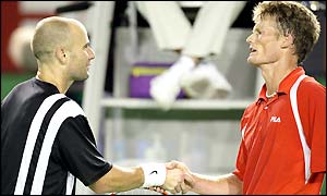 Agassi and Ferreira shake hands at the net at the end of their match