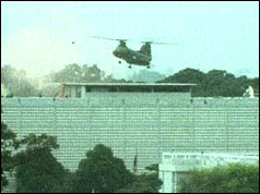 An American helicopter lands on the roof of the US Embassy, Saigon, during the evacuation