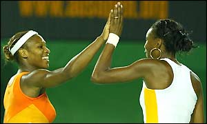 Serena and Venus Williams celebrate winning the second set to level the match