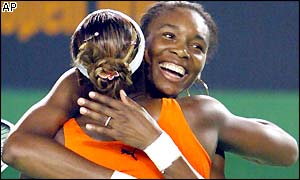 Serena and Venus WiIlliams show their delight at winning the doubles title