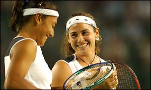 Virginia Ruano Pascual and Paola Suarez show their delight at winning the first set