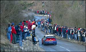 Scotland's Colin McRae drives along a spectator-packed stage on the first day of the Monte Carlo Rally