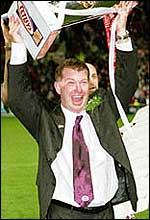 Ian Millward lifts the Super League trophy