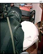 Man being arrested during the raids