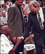 Phil Jackson shakes hands with Bulls legend Michael Jordan