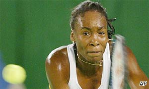Venus Williams struggles to reach a forehand 