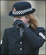 Police officer cries