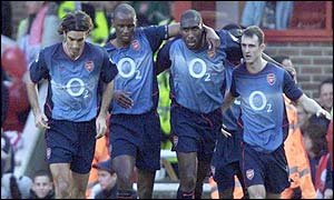 Arsenal players celebrate Sol Campbell's 19th minute goal against Farnborough