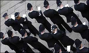 Police stand to attention outside the cathedral 