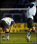 Hearts players show their dejection 