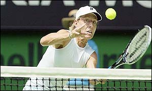 Martina Navratilova plays a volley over the net