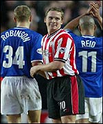 Kevin Davies congratulates former team-mates Paul Robinson and Steven Reid