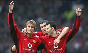 Ryan Giggs is congratulated by David Beckham and Roy Keane