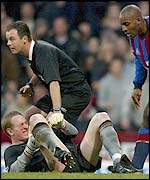 Liverpool keeper Chris Kirkland was injured after bravely blocking at Dele Adebola's feet