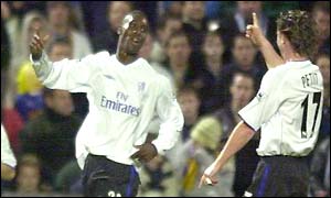 Carlton Cole celebrates his goal with Emmanuel Petit