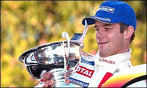 Sebastien Loeb holds his trophy after winning the prestigious Monte Carlo Rally, the first Frenchman to win the event for twenty years