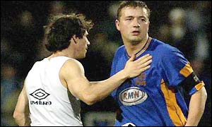 Gianfranco Zola comiserates Sherwsbury captain Nigel Jemson
