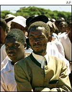 Voters wait in line outside a polling station last year