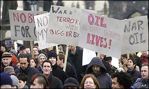 Protesters cross the Charles bridge in Prague
