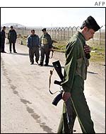 Iraqi guards at a military complex being inspected near Mosul