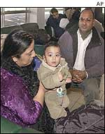 Pakistanis wait to cross to Canada from the US