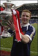 Kris Radlinski celebrates Wigan's victory in 2002