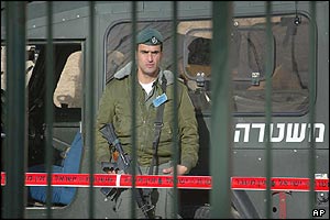 Israeli soldier guards road to polling station 