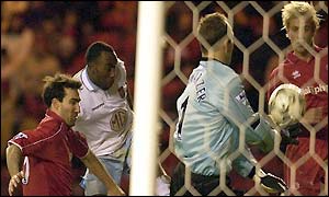 Darius Vassell fires in Villa's fourth goal