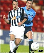 Gary Dempsey is tracked by Dundee's Barry Smith