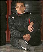 Justin Wilson sits in the pits 