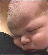 Baby on mother's shoulder