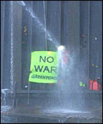 Protester is sprayed with water from deck of MV Lyra J