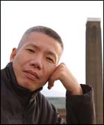 Chinese artist Cai Guoqiang in front of Tate Modern