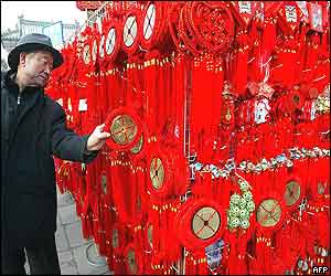 A man shops for traditional Chinese new year ornaments in Beijing