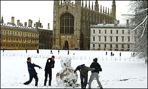 Cambridge University students have a snowball fight behind Kings College 
