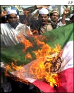 Bangladesh Islamic Students Fronts burn the Indian National flag during a anti-Indian protest.